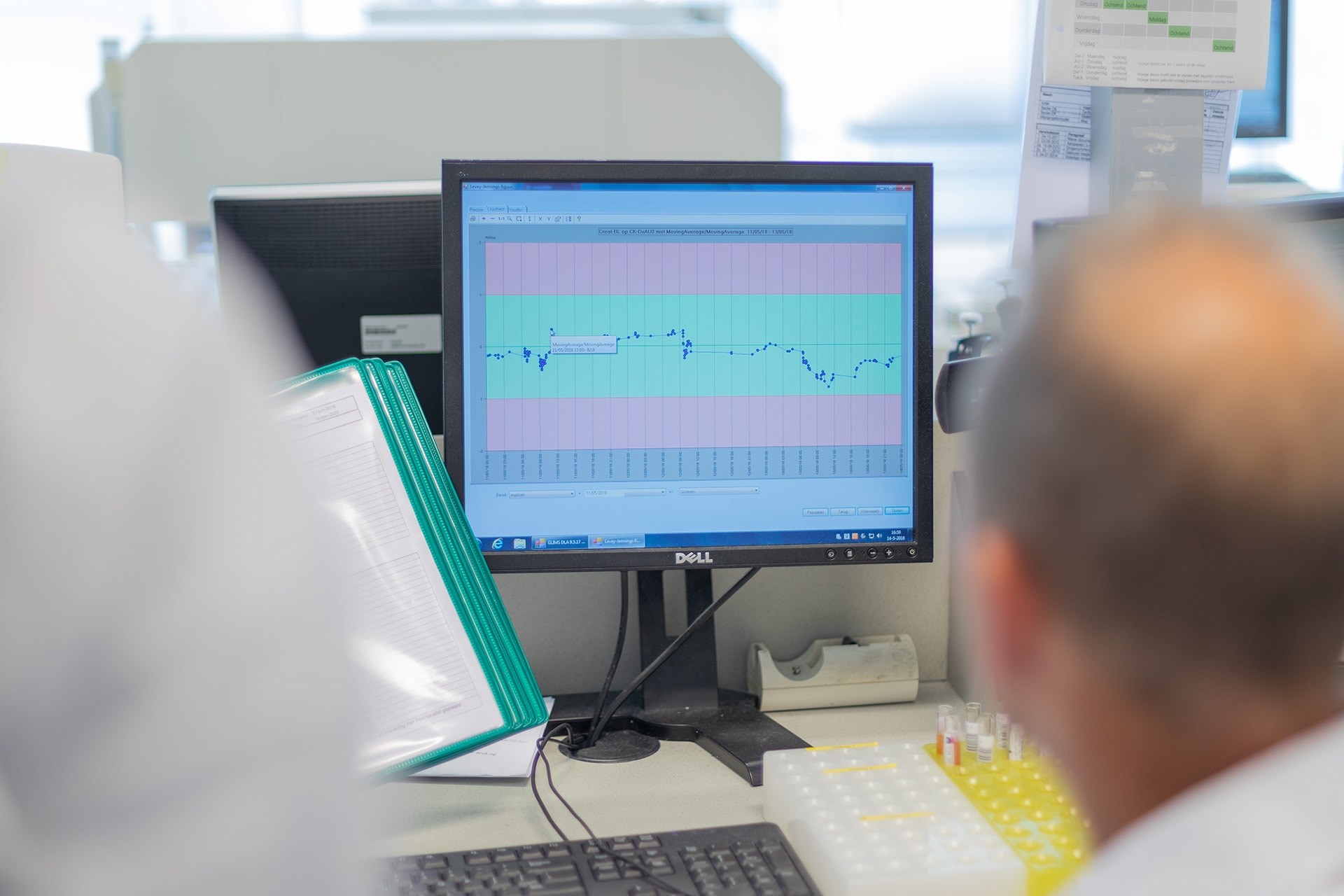 Huvaros professor looking at screen